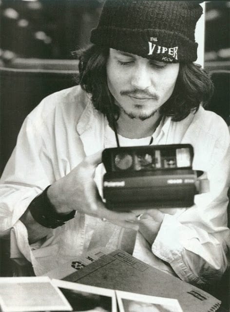 Johnny-Depp-with-camera-polaroid