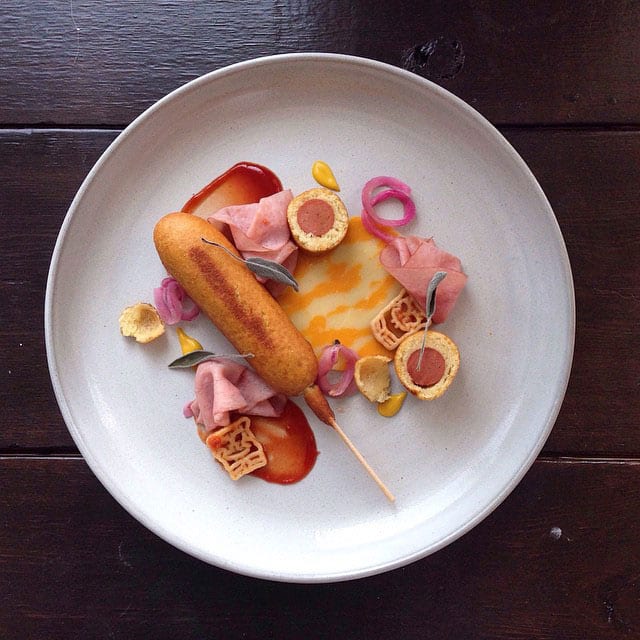"THIS IS A DUO OF POGOS W/ MARBLE CHEEZE SLICES, HONEY HAM ROSETTES, SPONGEBOB SQRPANTS ZOODLES AND MUSTARD TEARS!!!!" / © @chefjacqueslamerde / Instagram
